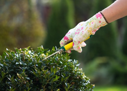Gardener wearing PPE while operating machinery